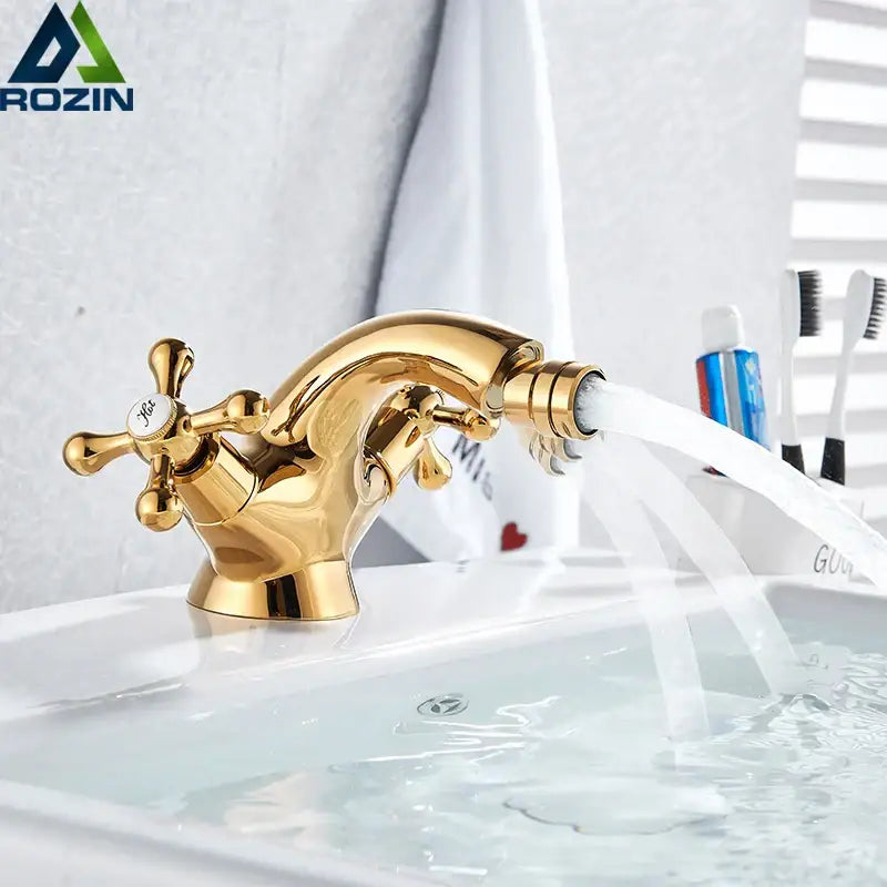 Ornate gold dual handle bidet faucet with curved spout and cross handles for bathroom vessel sink by decorbites