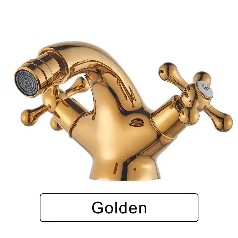 Ornate gold dual handle bidet faucet with golden brass finish and detachable spray head for bathroom vessel sink