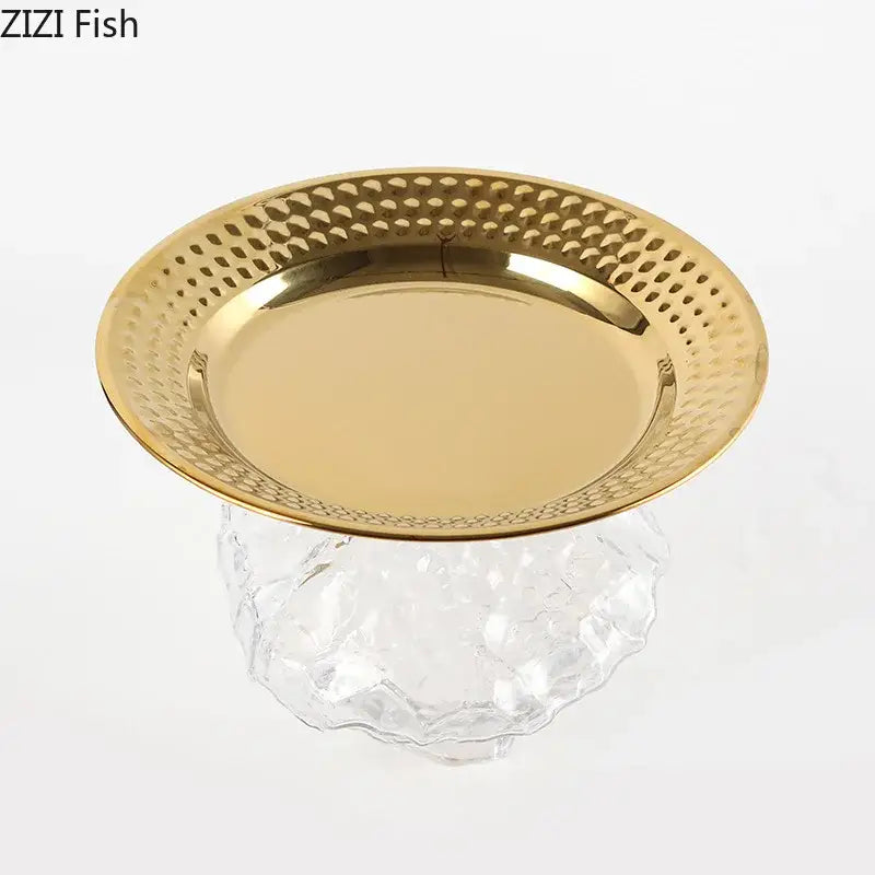 Ornate gold glass fruits bowl featuring a hammered metal serving tray with reflective center and textured rim
