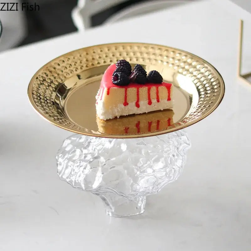 Ornate gold-toned hammered metal dessert plate with clear textured glass pedestal base for elegant glass fruits bowl use