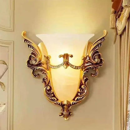 Ornate gold glass sconce light with intricate scrollwork frosted shade and crystals decorative wall lamp for living room