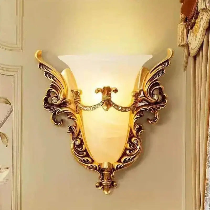 Ornate gold glass sconce light with intricate scrollwork frosted shade and crystals decorative wall lamp for living room