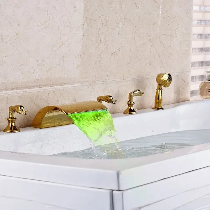 Ornate gold bath tub faucet with waterfall spout and sculpted duck-head handles for bathroom tub faucet use