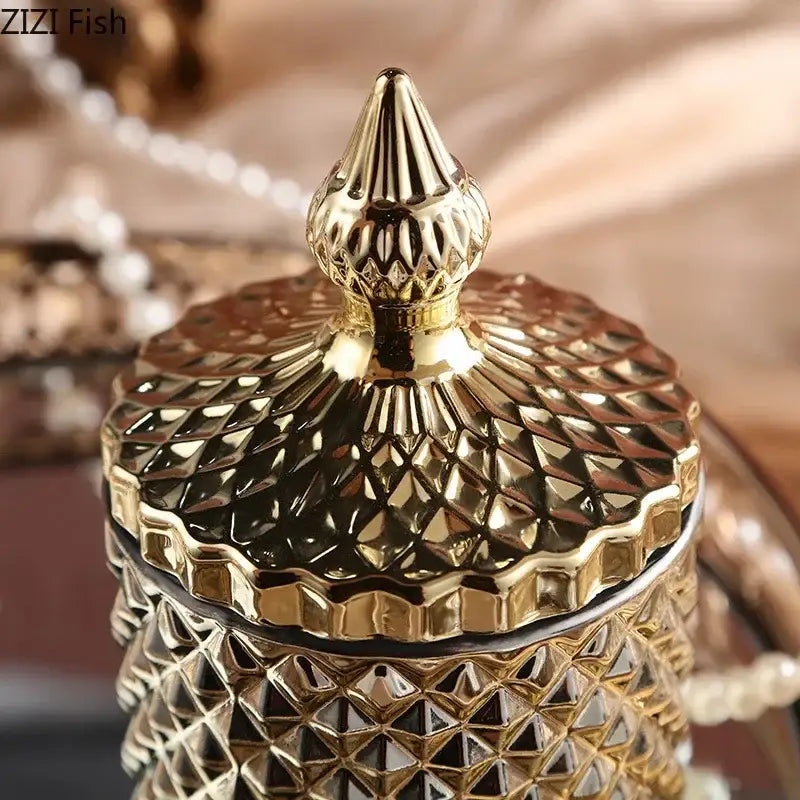 Ornate gold faceted glass storage jar with diamond-cut pattern and matching lid for elegant bedroom decor