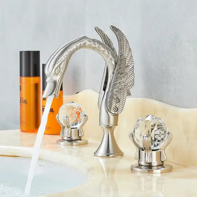 Silver swan-shaped basin faucet with ornate feather detailing and crystal knobs for decorbites gold swan basin use