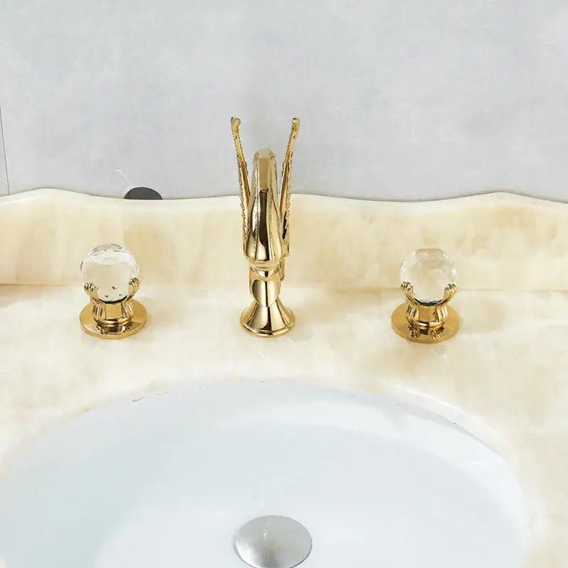 Ornate gold swan basin faucet set featuring three gold finished handles with crystal knobs for bathroom decorbites gold swan