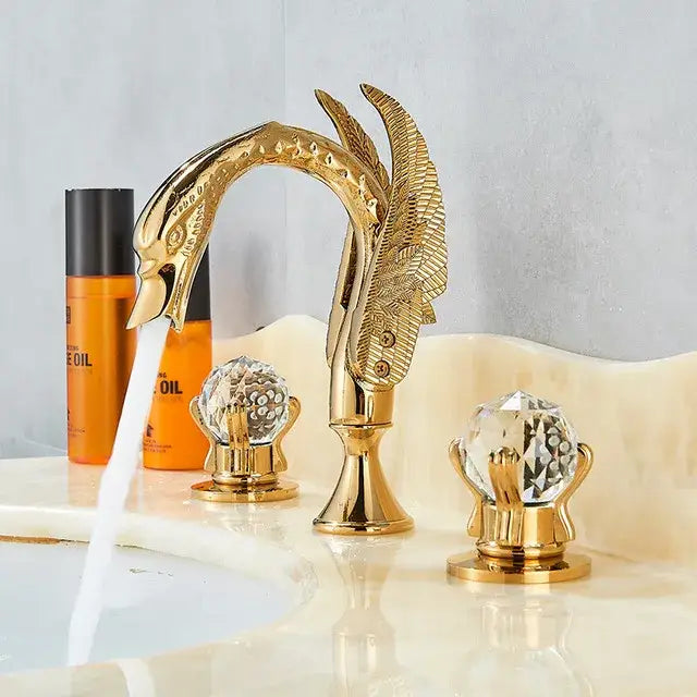 Ornate gold swan basin faucet with crystal handles featuring swan-shaped design and feathered wings for bathroom decorbites gold swan