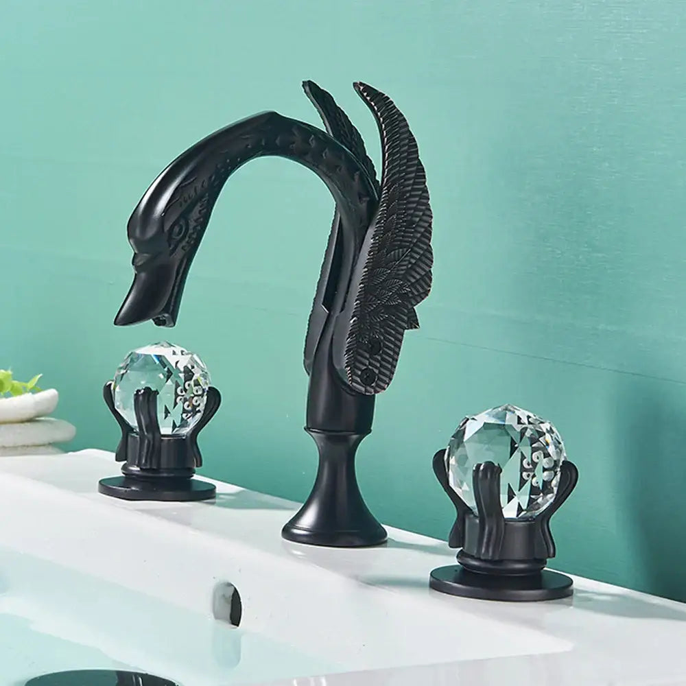 Ornate decorbites gold swan basin faucet with crystal handles and black swan design for bathroom use