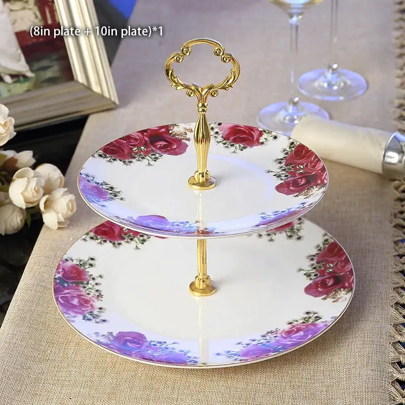 Two-tiered porcelain fruit plates set with gold ornate handle and red and purple floral pattern for dining room