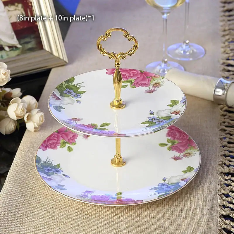 Two-tiered porcelain fruit plates set with ornate gold handle and pink purple white floral patterns for dining room use