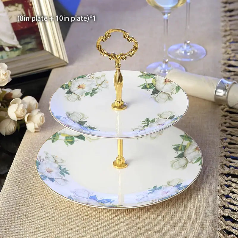 Elegant two-tier porcelain fruit plates set with gold-finished ornate handle and floral design for dining room use