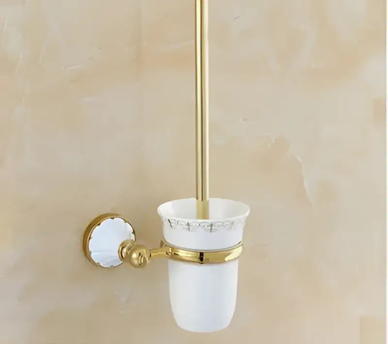 Ornate gold and white ceramic bathroom accessories set featuring gold-toned toilet brush holder with wall-mounted bracket decorbites bathroom accessories