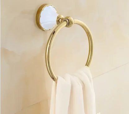 Ornate gold and white ceramic towel ring with polished metal finish from decorbites bathroom accessories set