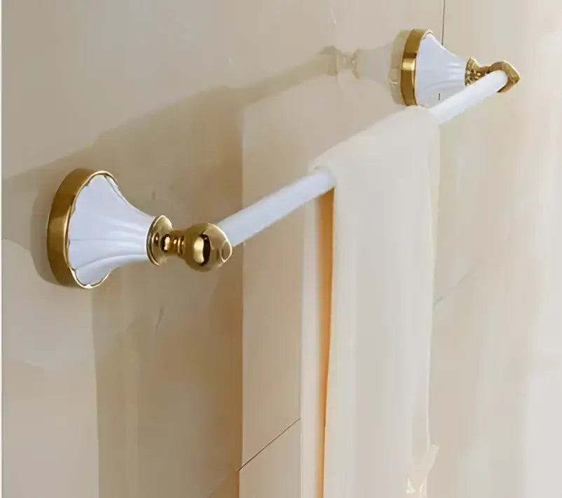 White and gold ceramic towel rack with sleek elegant design from decorbites bathroom accessories collection