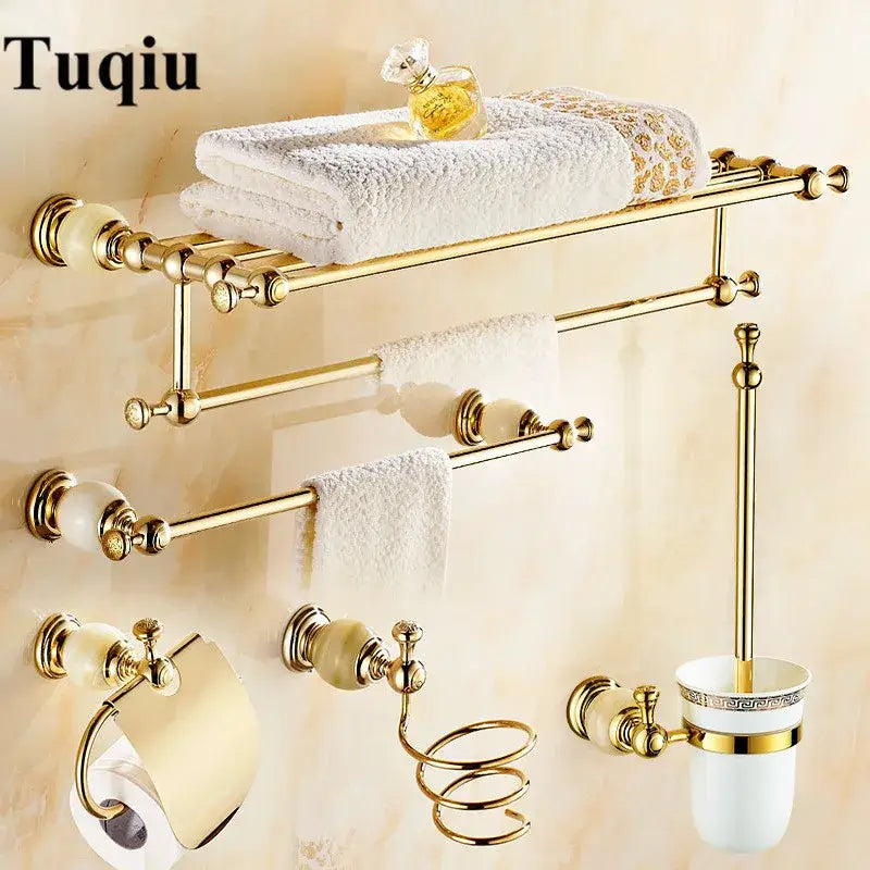 Ornate gold and white ceramic brass jade bathroom hardware set with detailed decorbites brass jade accents for luxury decor
