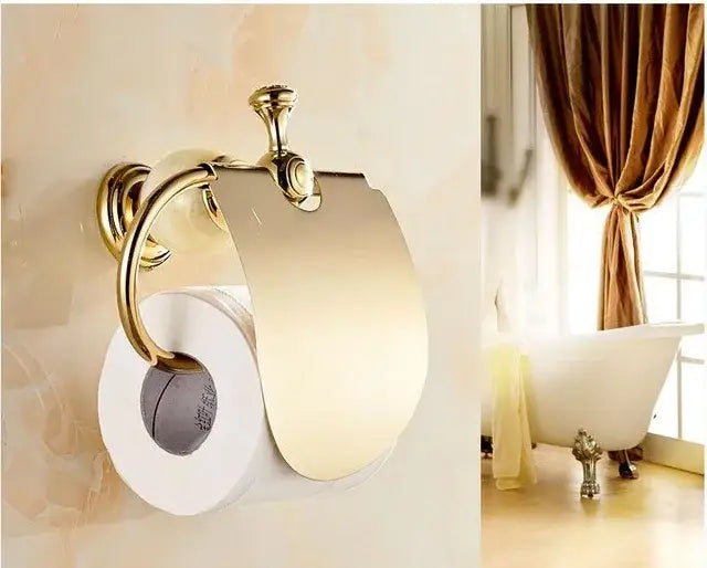 Gold-toned polished brass jade bathroom toilet paper holder with sleek curved design from decorbites hardware set