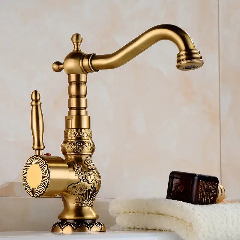 Ornate golden brass carved bathroom faucet with brass carved bathroom floral engraving and decorative fluted spout by decorbites