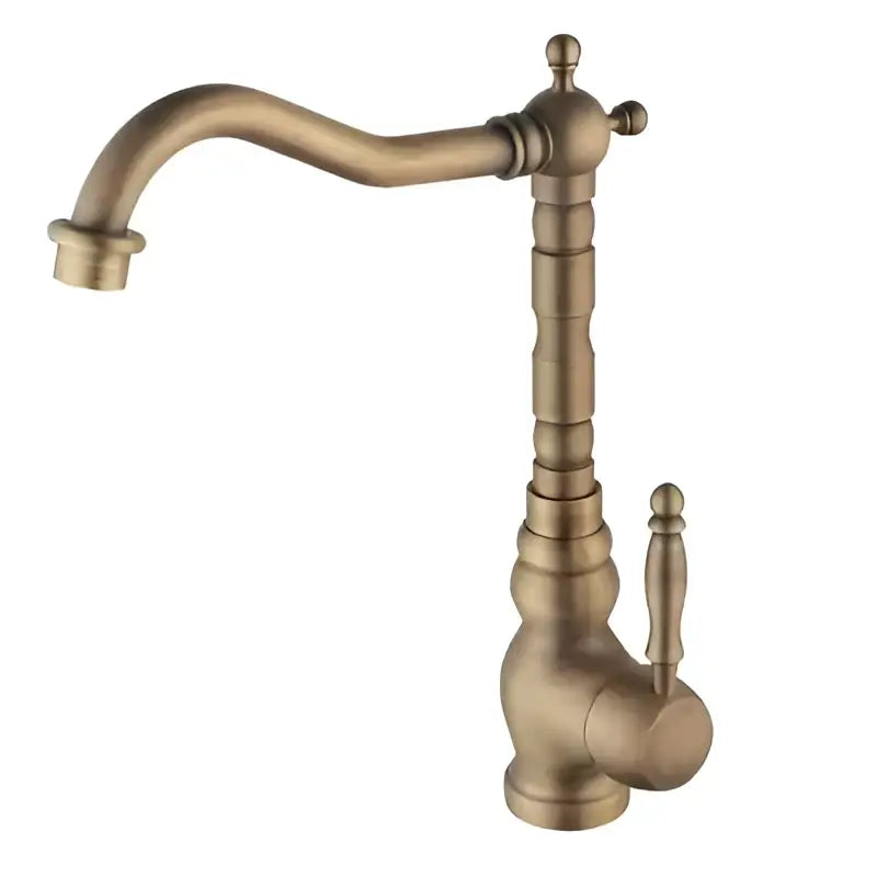 Ornate golden brass carved bathroom faucet with an antique brass finish curved spout and decorative segmented neck decorbites brass carved