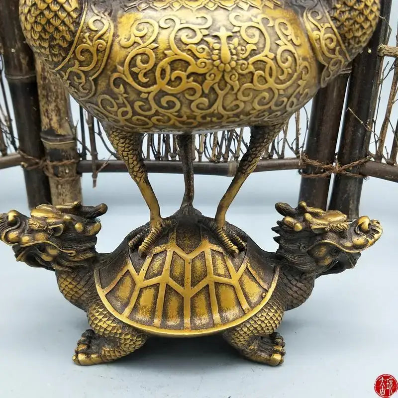 Ornate golden bronze incense burner shaped like a dragon on a turtle with intricate swirling patterns for decorbites dragon tortoise decor
