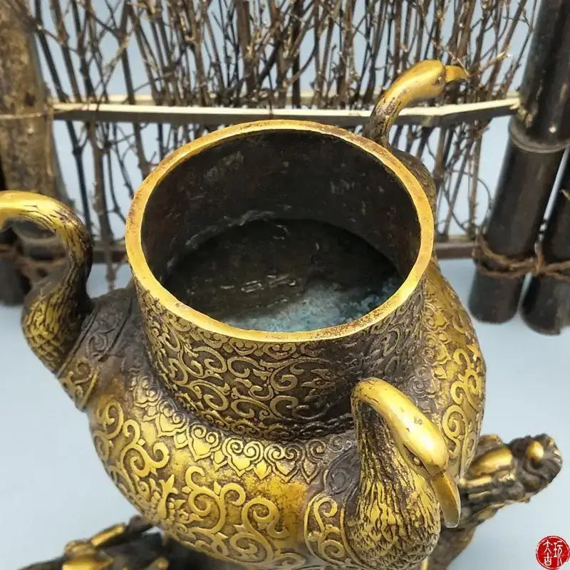 Ornate golden bronze phoenix incense burner with intricate swirling patterns for decorbites dragon tortoise living room decor