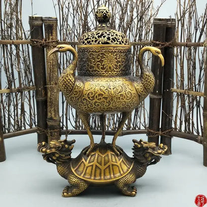 Ornate golden incense burner featuring a phoenix with floral patterns on a decorbites dragon tortoise base for living room decor