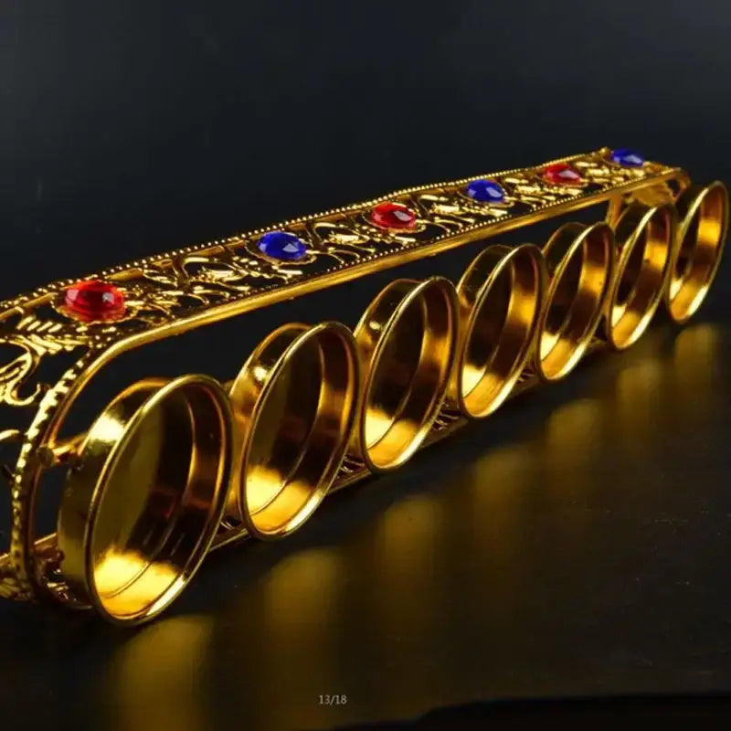 Ornate golden gem inlaid candlestick stand with intricate filigree and red blue gemstones for wedding altar decorbites decor