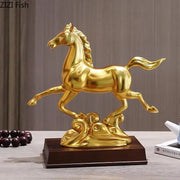 Ornate golden horse mascot resin statue with a glossy finish standing on an ornate base for living room decor