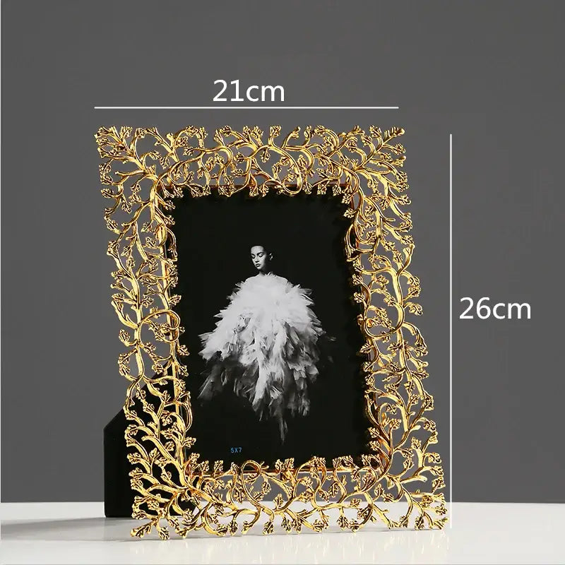 Ornate golden leaves metal photo frame with intricate leaf and vine detailing for living room decor by decorbites golden leaves