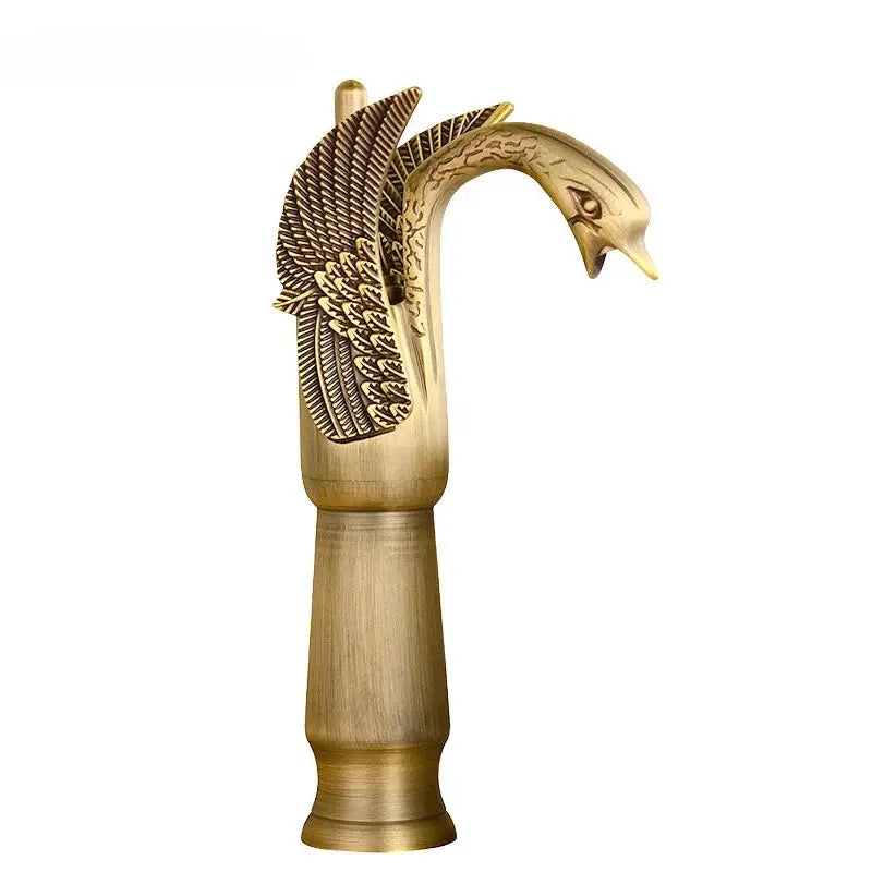 Ornate golden swan solid brass basin faucet with ceramic valve core and intricately detailed wings for bathroom use