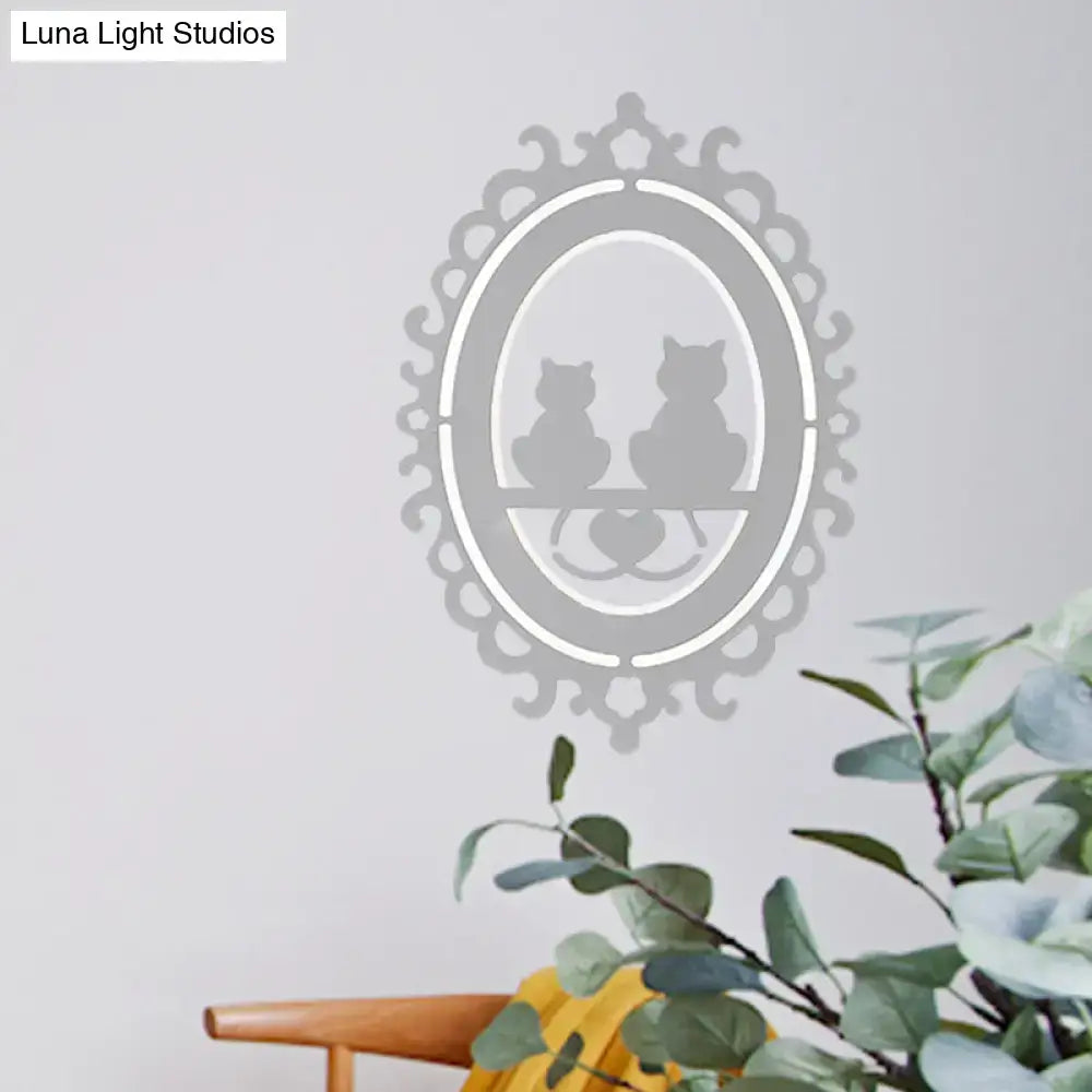 Ornate gray cat silhouette led wall light featuring a delicate silver-toned oval frame inch fixture for kitchen decor