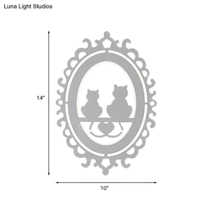 Ornate gray cat silhouette led wall light inch fixture featuring silver oval art with two cats on a bench and scalloped border