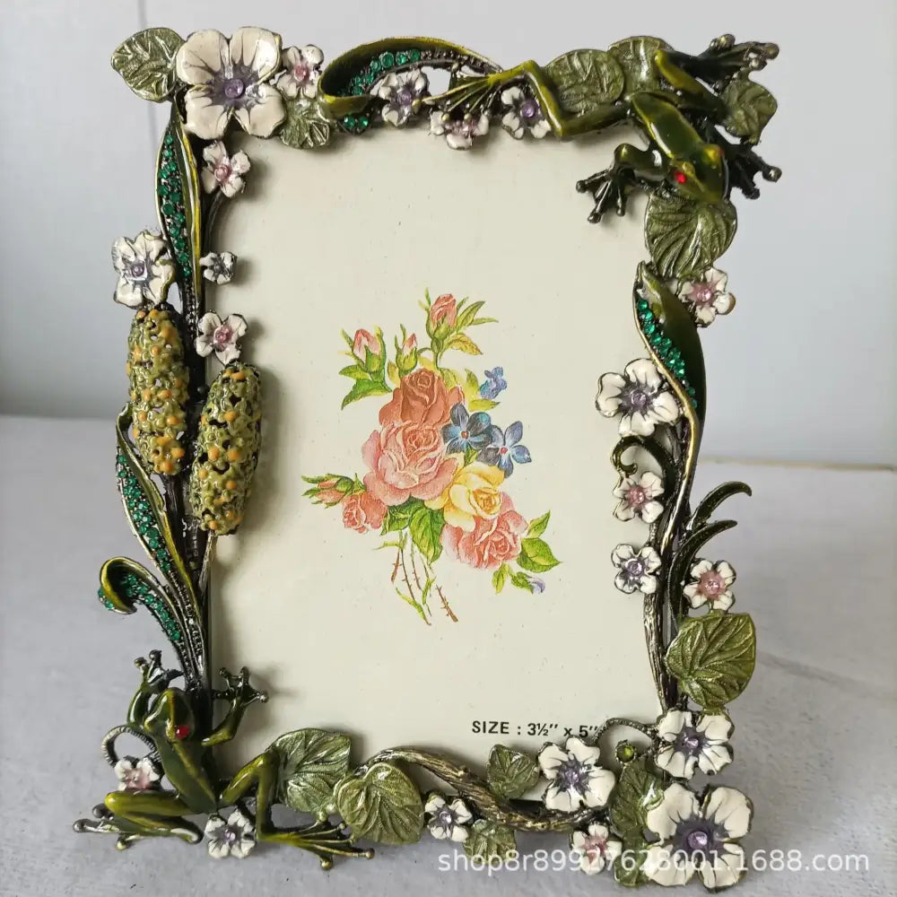 Ornate green and gold metal photo frame with detailed frog metal figures and gemstone accents for living room decorbites frog metal decor