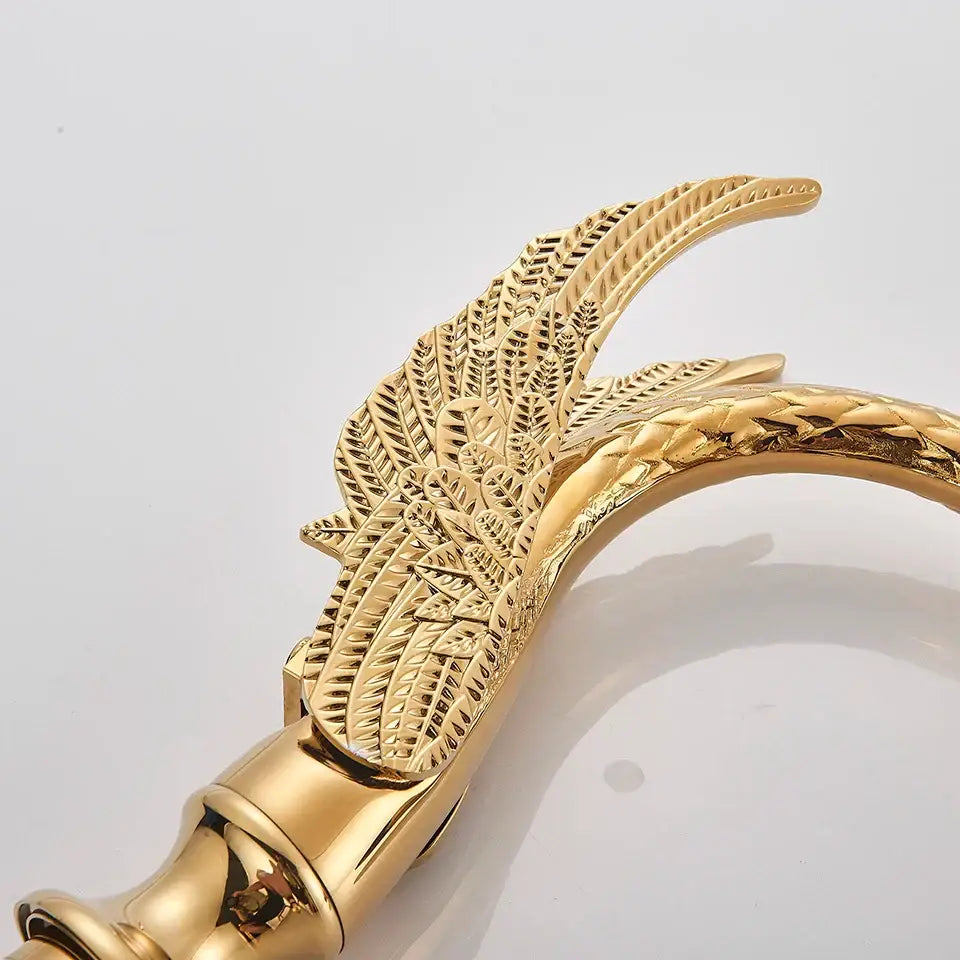 Ornate swan gold bathtub faucet with intricate leaf and feather detailing designed for elegant bathroom decorbites black bathtub