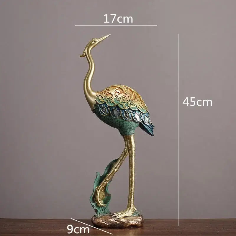 Ornate teal and gold crane bird sculpture with intricate feather patterns for living room decor by decorbites crane bird