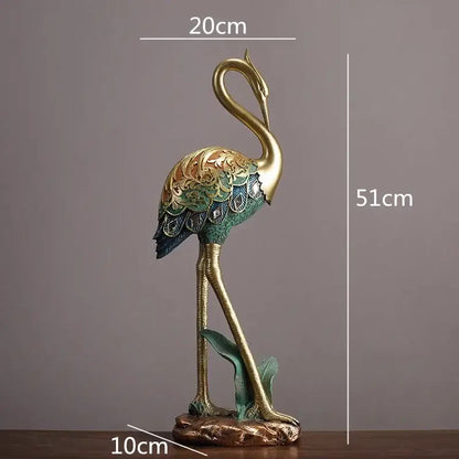 Ornate teal and gold crane bird sculpture with intricate feather patterns standing on a textured base for living room decor