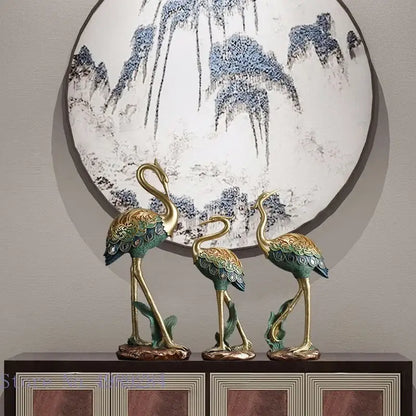 Ornate teal and gold crane bird sculpture with intricate feather detailing for living room decor by DecorBites crane bird