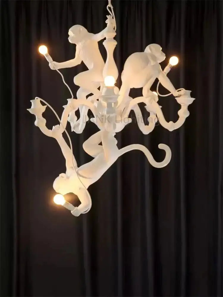 Ornate white ceramic monkeys pendant chandelier featuring intricately sculpted monkeys holding light bulbs for living room decor