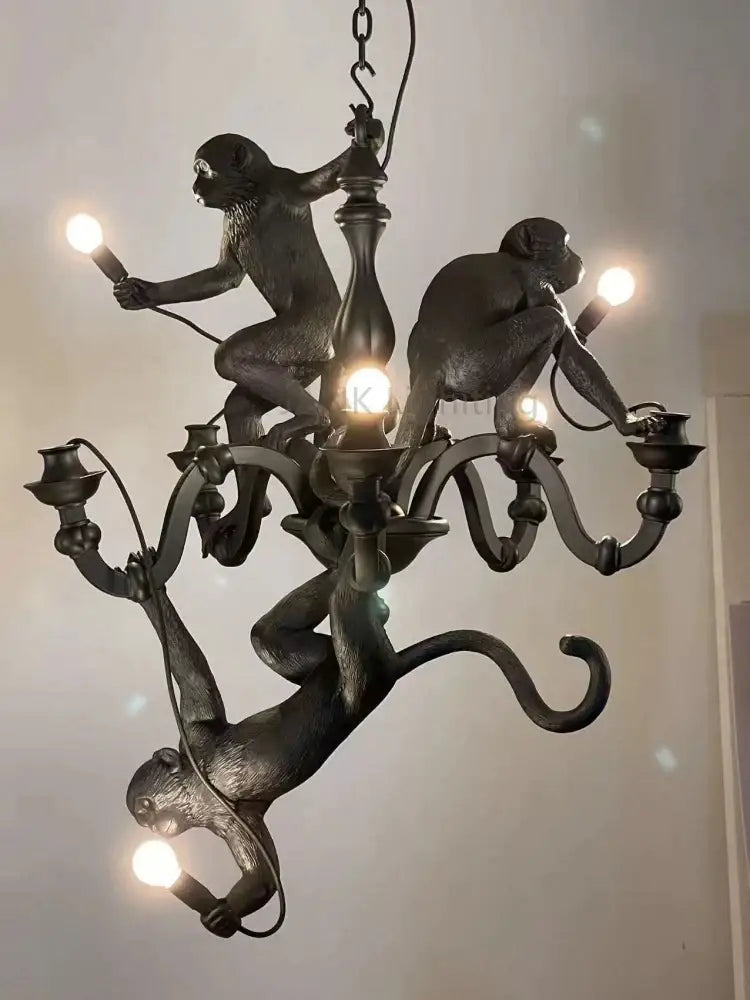 Dark bronze monkeys pendant chandelier with sculpted primates and ornate metal arms for living room decor