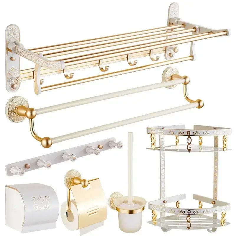 Ornate white and gold bath hardware set with decorative floral patterns by decorbites bath for elegant bathroom decor