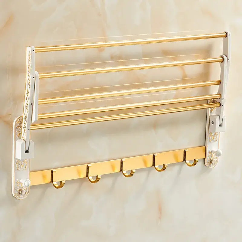 Ornate white and gold bath hardware set featuring a gold multi tiered wall mounted towel rack with decorative white side panels by decorbites bath hardware