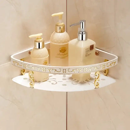Ornate white and gold decorbites bath hardware set corner shelf with decorative metal legs holding beige lotion bottles