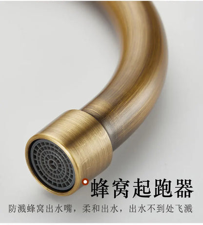 Antique brass finished single hole outdoor antifreeze faucet with curved spout and gray mesh filter for balcony use