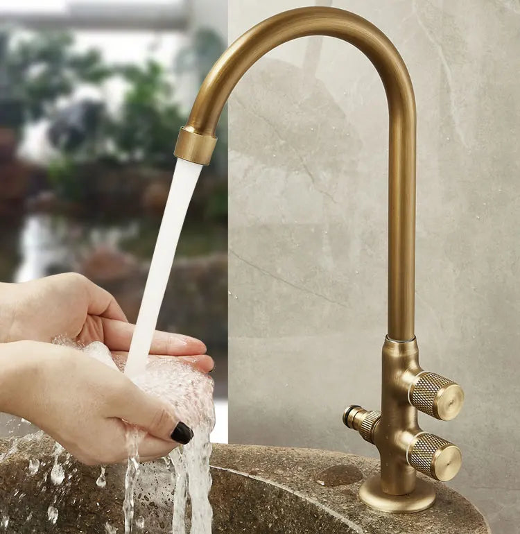 Antique brass single hole outdoor antifreeze faucet with curved spout and two textured knobs for balcony wash basin