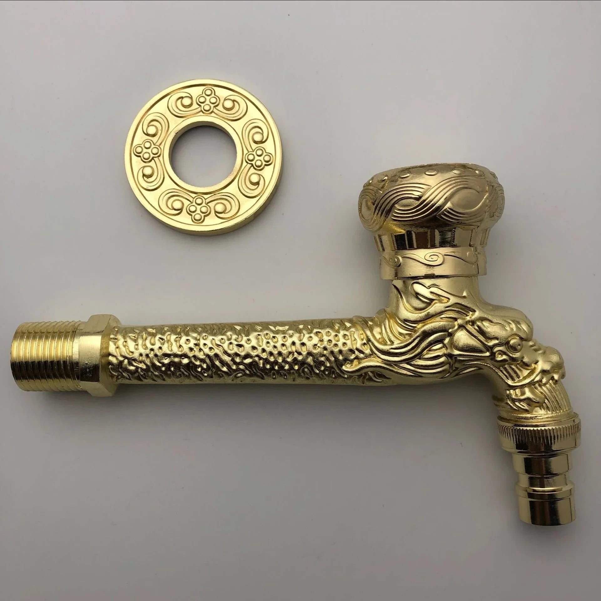 Golden brass wall mounted outdoor faucet with intricate dragon design and ornate zinc alloy circular flange