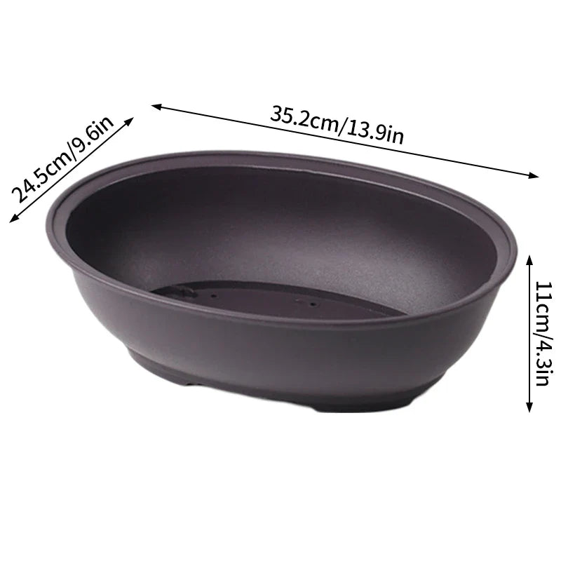 Black oval ceramic bonsai pot with smooth matte finish and subtle rim detailing for succulent plants pots and plants pots