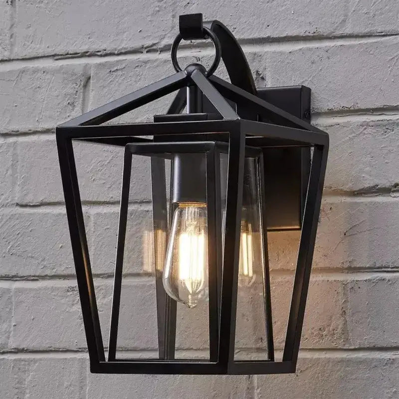 Black wrought iron outdoor wall light with glass shades and exposed filament bulb by decorbites waterproof design