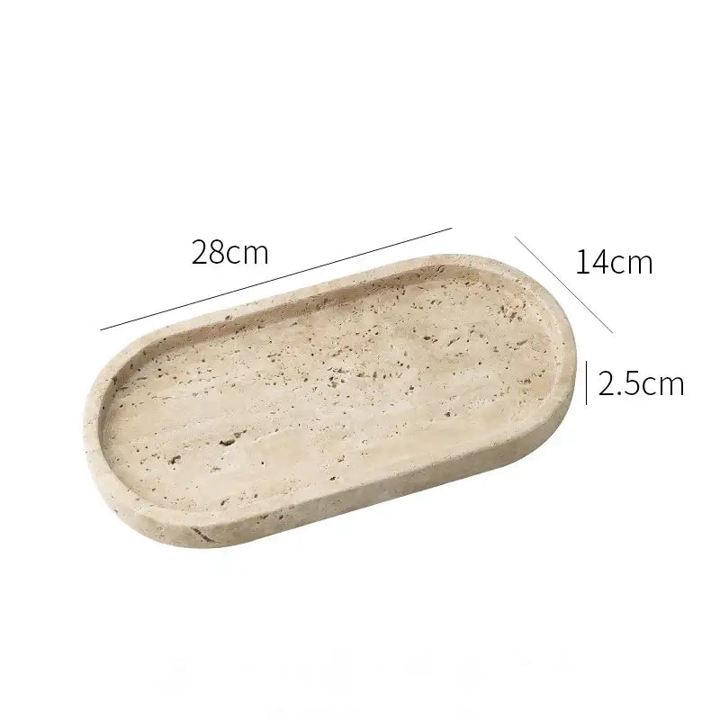 Beige concrete oval vanity tray with textured surface and rounded edges for decorbites calacatta marble bathroom use