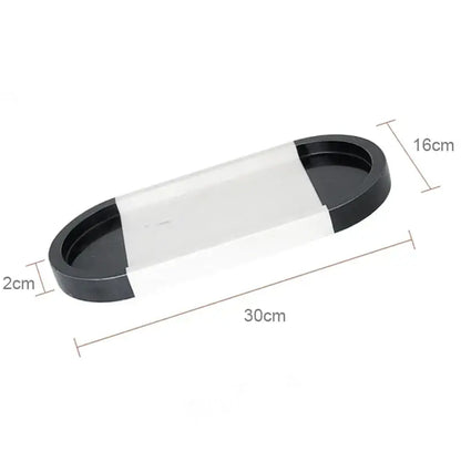 Black and transparent oval vanity tray with glossy finish measuring 30cm by 16cm suitable for calacatta marble decorbites vanity