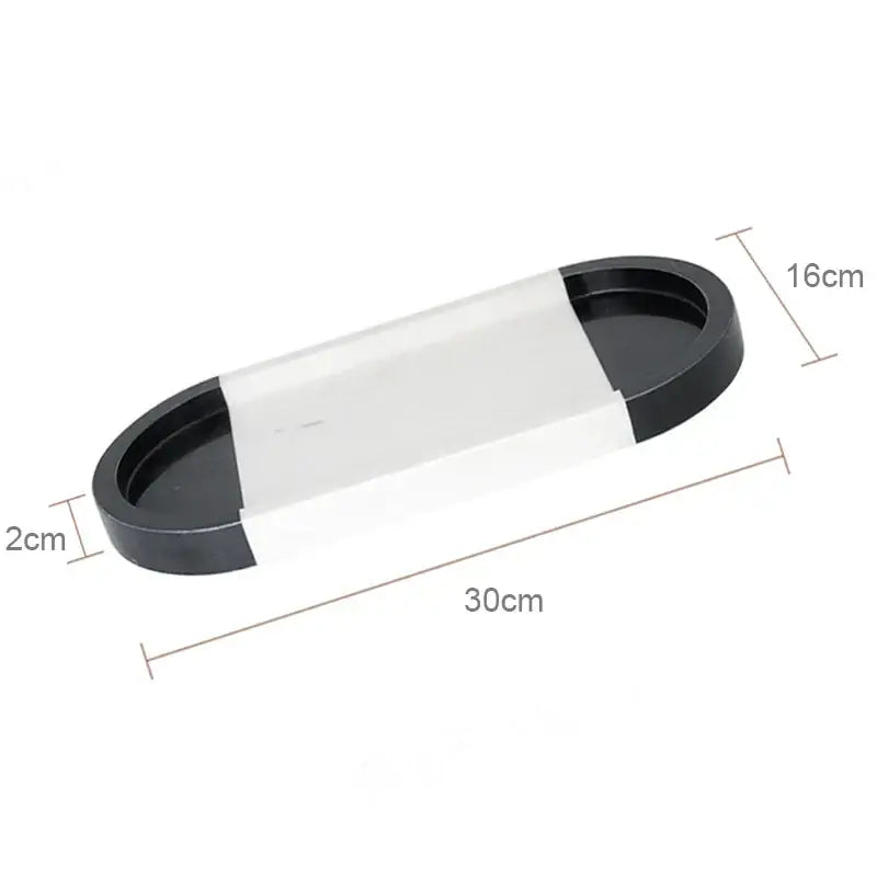 Black and transparent oval vanity tray with glossy finish measuring 30cm by 16cm suitable for calacatta marble decorbites vanity