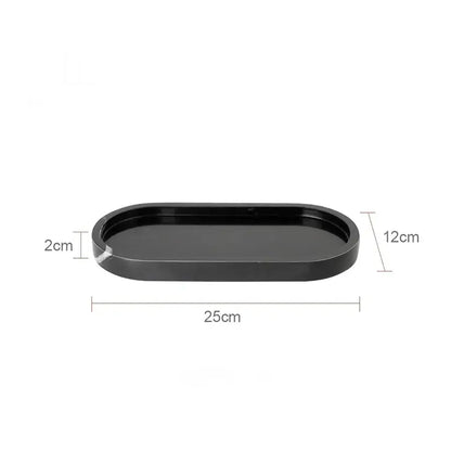 Black oval vanity tray with smooth glossy finish and rounded edges by decorbites calacatta marble for bathroom use